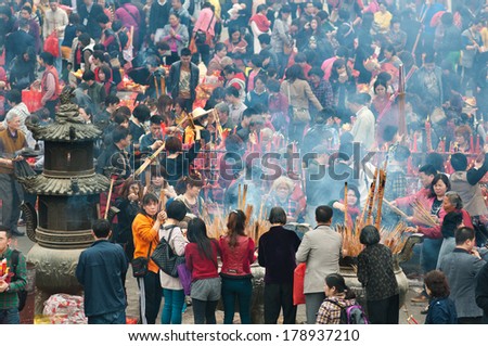 FOSHAN, CHINA - FEB 25, 2014:Legend year today a Buddism godness Guanyin open warehouse, giving people, Buddhist believers to pray and hope to borrow money, great luck in making money