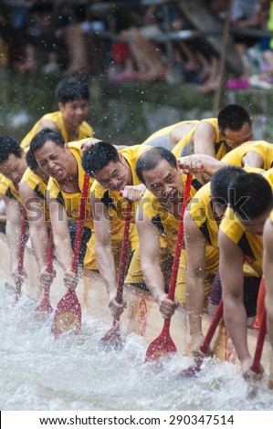 FOSHAN-June 23:The Dragon Boat Festival dragon boat in Fen rivers, there are 17 dragon boat teams took part in the game, attracted tens of thousands of people watched June 23, 2015 in Foshan, China