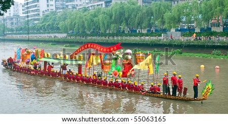 FOSHAN CITY, CHINA - MAY 30: Participants in action at Fenjiang River Dragon Boat Race June 12, 2010 in Foshan City, China