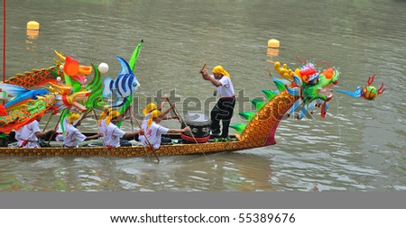 FOSHAN CITY, CHINA - JUNE 12: Participants In Action At FenJiang River Dragon Boat Race June 12, 2010 in FoShan City, China