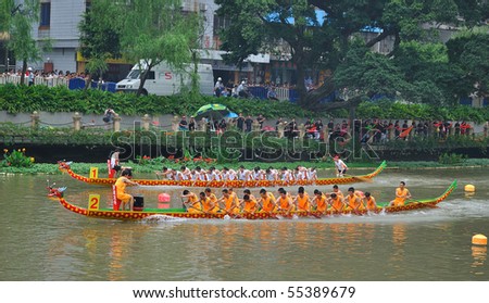 FOSHAN CITY, CHINA - JUNE 12: Participants In Action At FenJiang River Dragon Boat Race June 12, 2010 in FoShan City, China