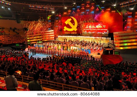 FOSHAN CITY, CHINA - JUNE 27: Members of the Communists Party celebrate the 90th Anniversary Of The Establishment Of Communist Party of China during a cultural show on June 27, 2011 at Foshan City Stadium in Foshan City, China.