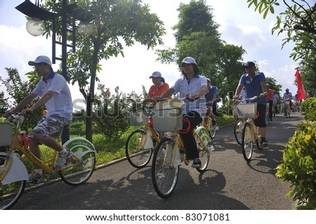 FOSHAN CITY, CHINA – AUGUST 13: Foshan Municipal Government organized bicycle parade promoting green traveling on August 13, 2011 in Foshan City, China