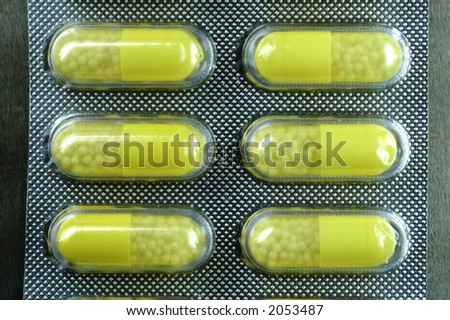 Capsule. Isolated capsule. Blister with capsules. Yelow Pills.