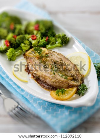 mackerel with steamed broccoli, selective focus