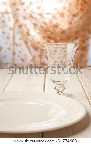 luxury wine glass and dish on table selective focus on glass