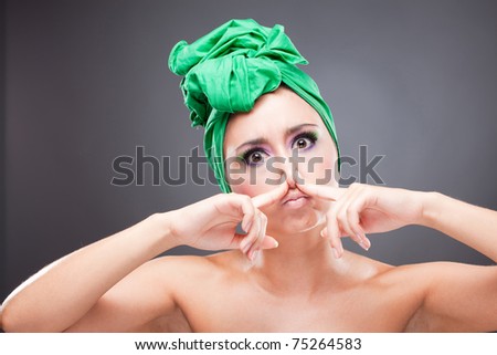 Beautiful woman pinch nose sulk
