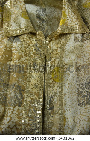 Close-up of designer silk blouse with retro pattern
