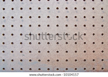 Perforated particle board