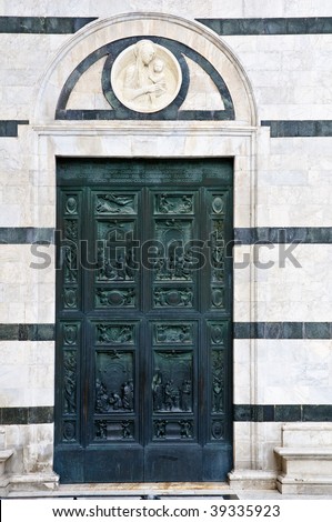 Bronze door of Duomo - Siena, Italy.