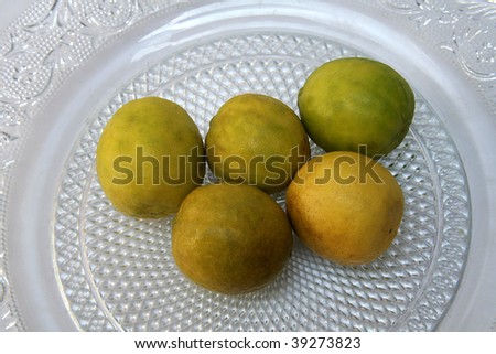 Lemon is a pale yellow, thick-skinned citrus fruit with sour, acidic juice containing vitamin C