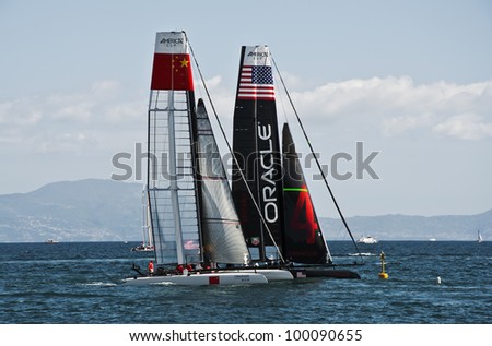 NAPLES - APRIL 12: catamarans of China and US teams race during the america\'s cup world series competition on April 12, 2012 in Naples