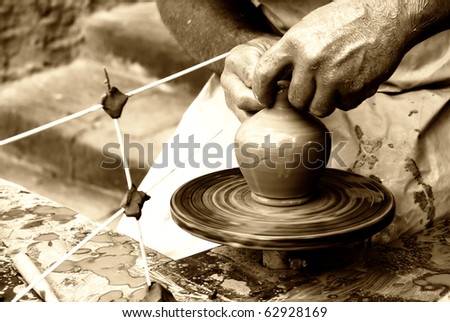 man doing an ancient craft