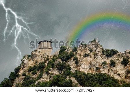 storm with rain lightning and rainbow