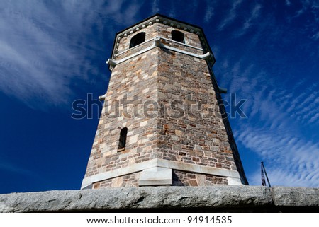 Stone Tower Fox Hill War Memorial against a bright blue sky