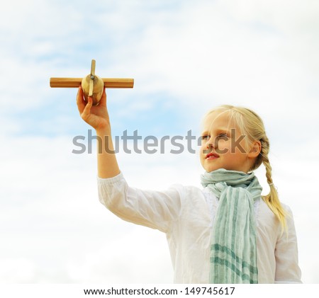 Childhood - kid with airplane toy, freedom concept, fine art portrait