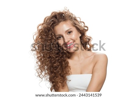 Similar – Image, Stock Photo Portrait of a beautiful dark-haired young sexy woman lying happily contentedly in bed of moss in the forest with in an old willow tree with naked shoulders and deep peace in the smile