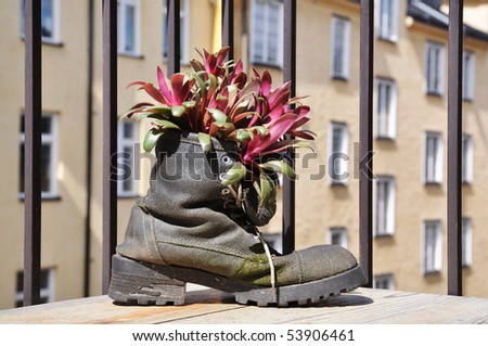 Boot with plant on a balcony in the city of Stockholm, Sweden.
