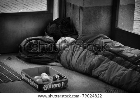 STOCKHOLM, SWEDEN - OCT. 29: An unidentified homeless man sleeping at the entrance to the subway in Stockholm, Sweden on October 29, 2010. There are about 5,000 homeless people in Stockholm, where the population is 1.3 million.