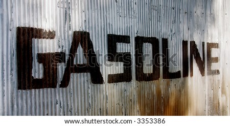 This is a picture of an old sign hand painted on a corrugated steel wall from an old abandoned gas station. photo from left to right.