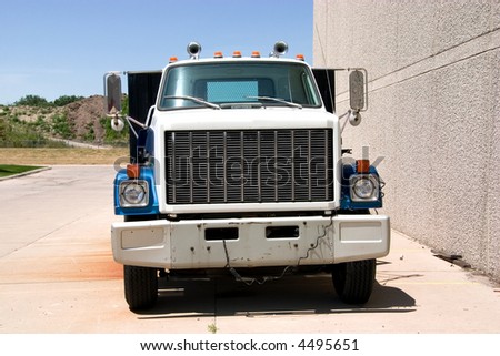 This is the front of a mid 1980\'s flat bed truck.