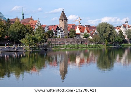 Ulm, view on Danube River, old City Wall (Shaufermauer) and leaning Butcher\'s Tower (Metzgerturm), Germany
