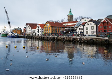STAVANGER, NORWAY - MARCH 6, 2011: Guest harbour with old-style houses. Stavanger was founded in 1125, and now it is Norway\'s third largest city, also called the petroleum Capital of Norway.