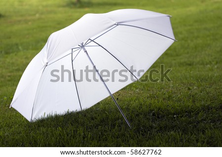 White, transparent umbrella for studio photography.