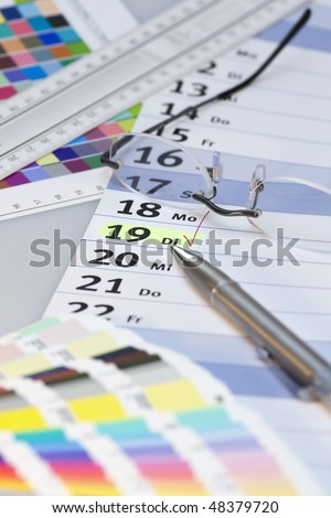 Check-mark on calendar with pen