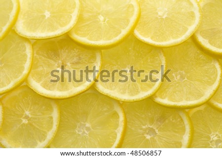 Slices of lemon background, focus on foreground; close-up view;