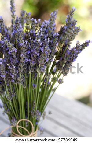 Blue fresh lavender bouquet on a wooden table