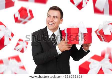 Business man happy smile hold gift box in hands think look up,  present fall fly around. Isolated over white background
