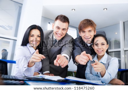 Business people group team point finger at you, Successful excited young businesspeople happy smile at office desk