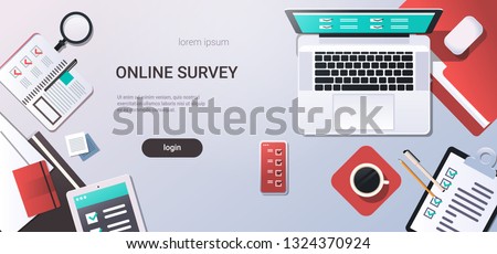 workplace desk online testing questionnaire form survey concept internet quiz laptop computer top angle view office stuff flat copy space horizontal