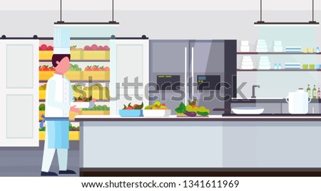 chef cook carrying plate with fresh fruits vegetables meal ingredients kit food cooking and culinary concept modern commercial restaurant kitchen interior horizontal flat