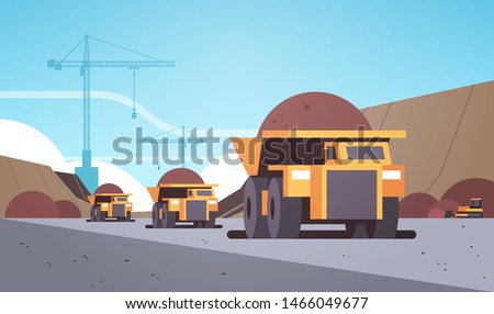 heavy yellow dumper trucks. professional equipment working on coal mine production. mining transport concept opencast stone quarry background flat horizontal.