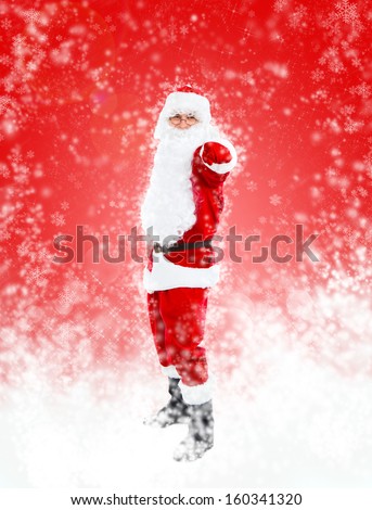Santa Claus red christmas background point finger at you to the camera gesture full length portrait, concept of merry christmas time and happy new year abstract winter snow