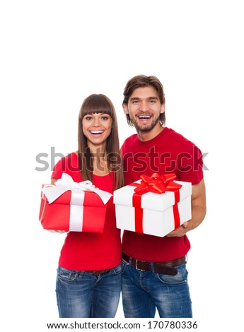 holiday happy couple hold present gift box wear red shirt, man and woman love smile embracing, isolated over white background
