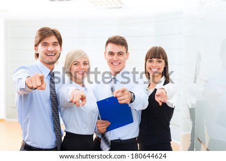 Business people group team point finger at camera you, Successful excited young businesspeople happy smile at office