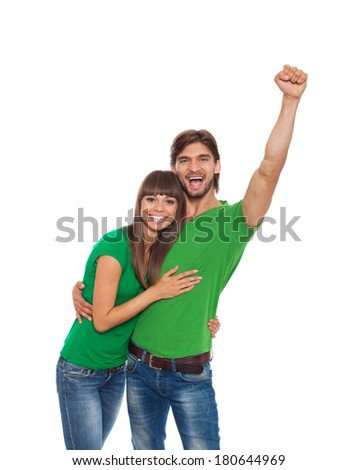 couple excited happy smile hold fist ok yes gesture, man and woman wear green t shirt raised hands arms, isolated white background