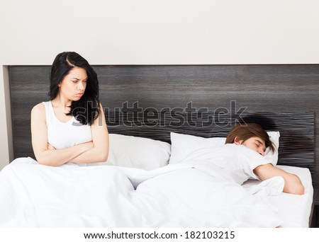 unhappy separate couple lying in a bed, having conflict problem cheat, upset sad negative emotions concept
