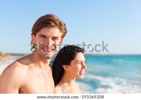 Couple on beach, face looking side ocean horizon copy space, Young happy man and woman sea shore smiling romantic, summer vacation holiday