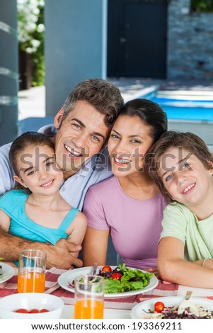 family lunch home couple with children, eating happy love smile, sitting at dinner table