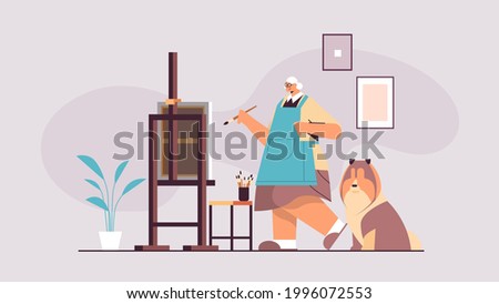 Similar – Image, Stock Photo Senior artist standing in home workshop and choosing paints