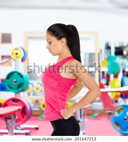 sport fitness woman in gym, young healthy girl, perfect figure sporty slim body