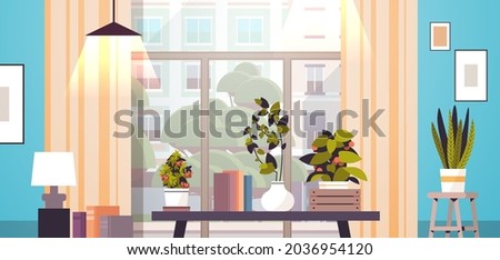 greenhouse potted plants on table gardening concept living room interior horizontal