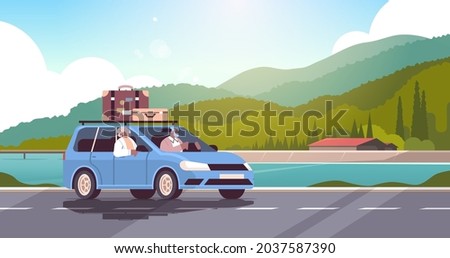 old family driving in car on weekly holiday senior african american travelers couple traveling by car active old age