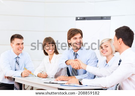 Business people handshake, businessmen smile hand shake, during meeting signing agreement sitting at desk office, corporate team work group on bank conference