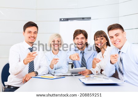 Business people group team point finger at you, Successful excited young businesspeople happy smile at office desk