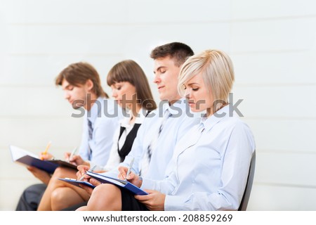 business people group smile sitting row, line in office meeting conference room, businesspeople interview with colleague, human resources
